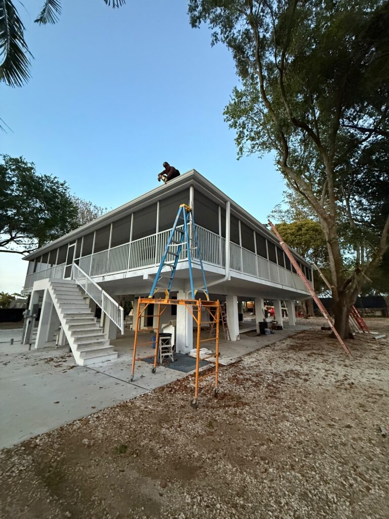 Ladder set against a roof edge for a gutter inspection