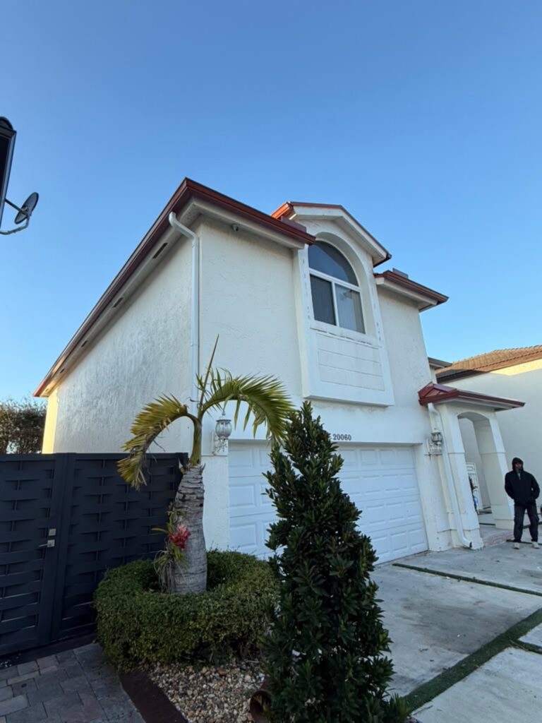 Downspout installation carrying water away from the foundation, Fort Lauderdale, Florida