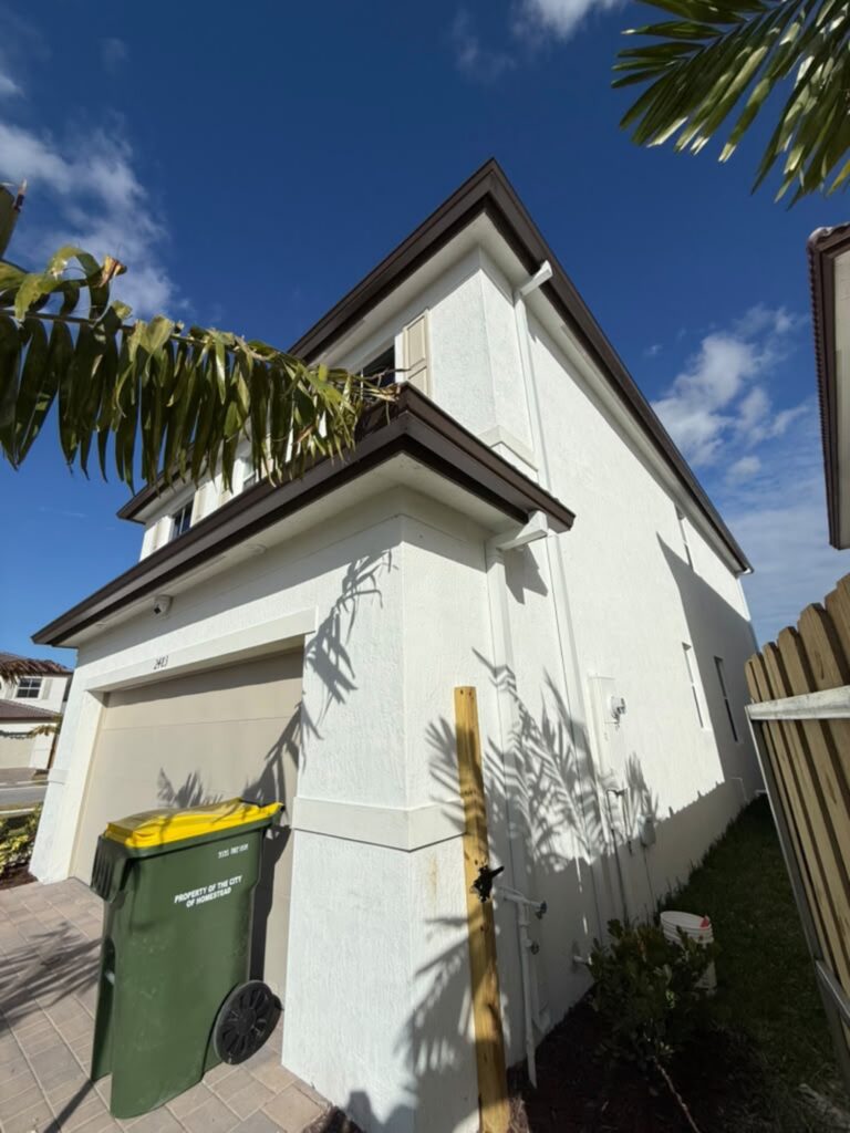 Seamless gutter installation on a home in Opa-locka, Florida