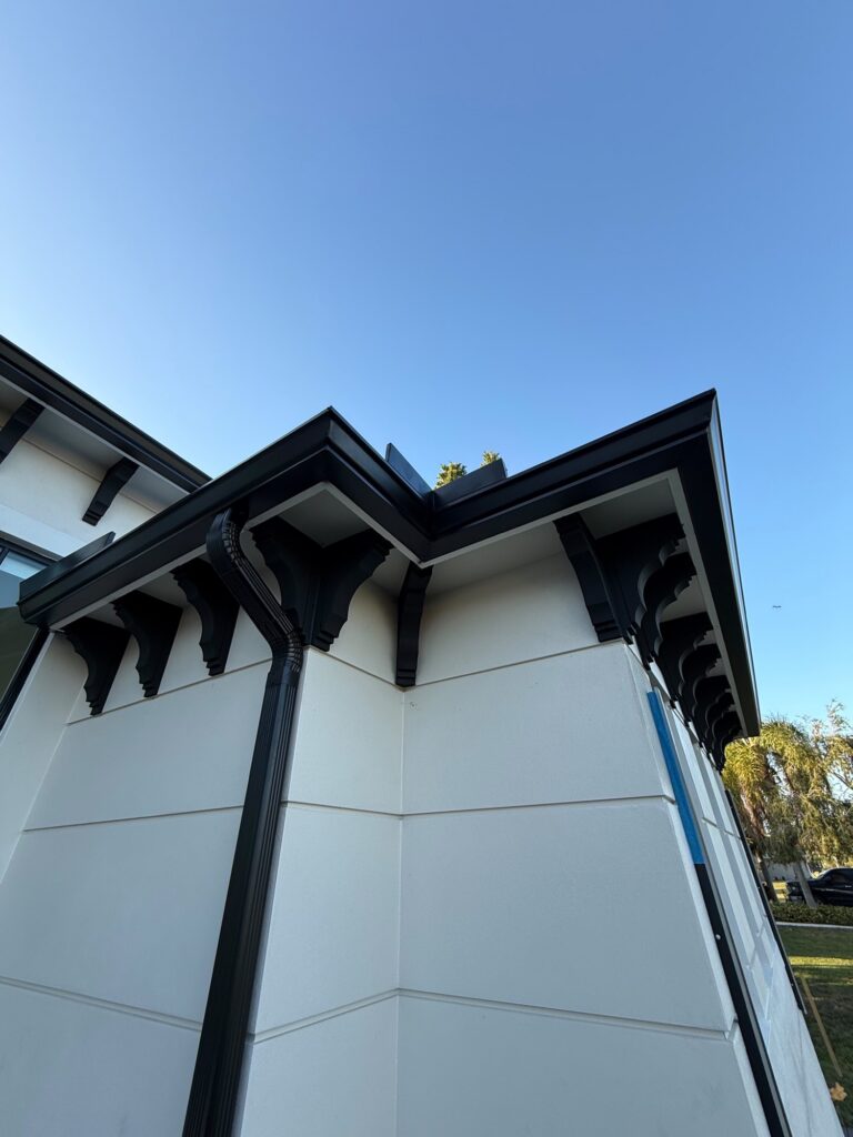 Downspout installation carrying water away from the foundation, Fort Lauderdale, Florida