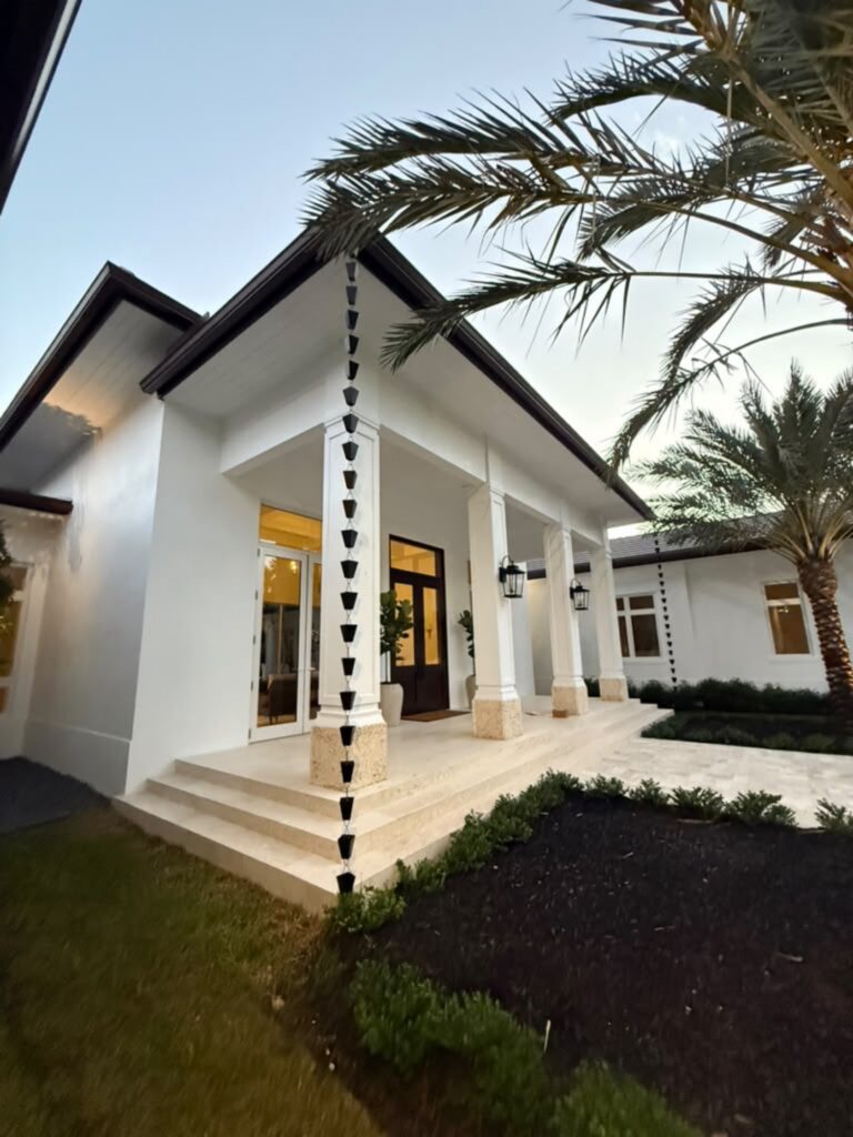 Downspout installation carrying water away from the foundation, Fort Lauderdale, Florida