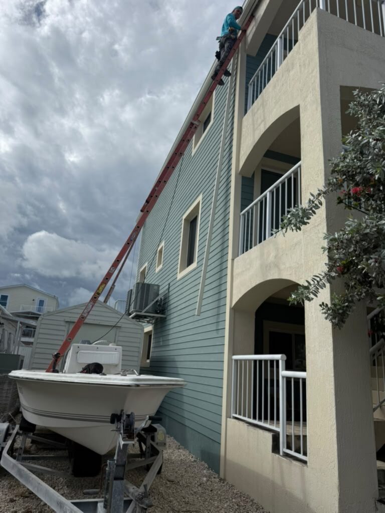 Downspout installation carrying water away from the foundation, Fort Lauderdale, Florida