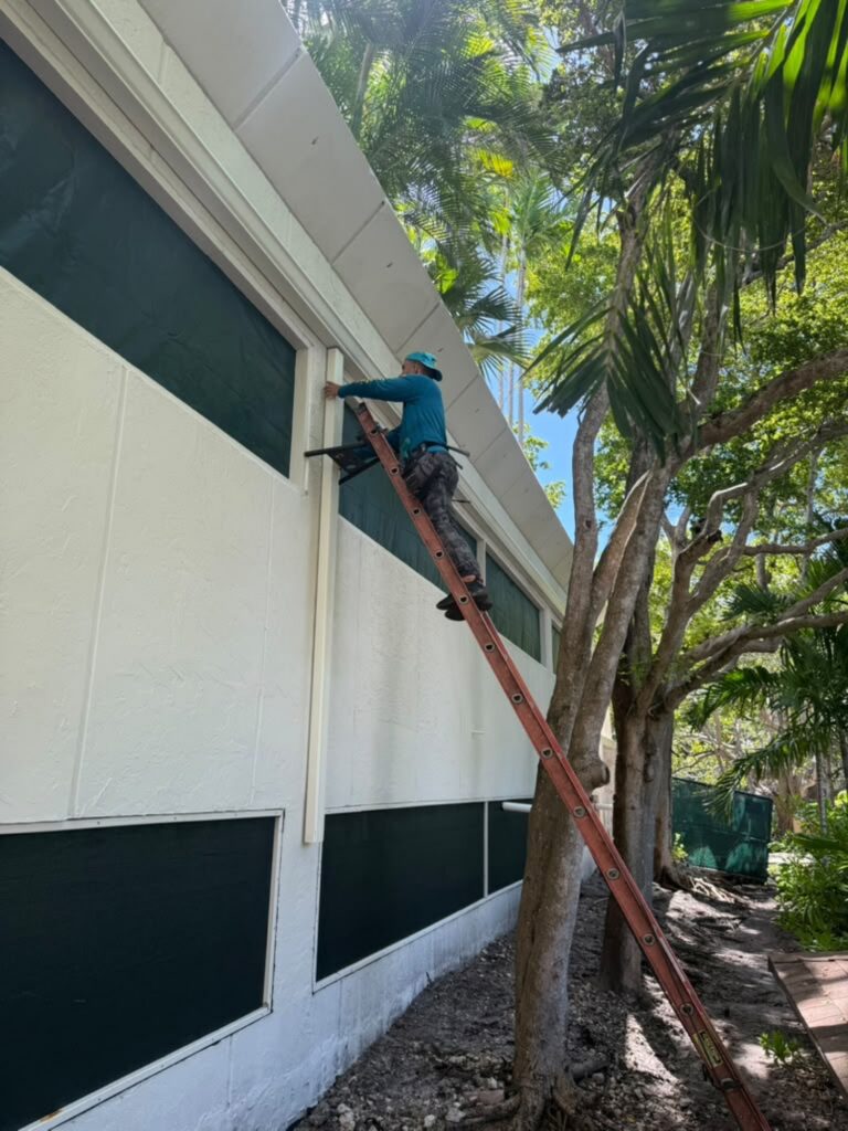 Downspout installation carrying water away from the foundation, Fort Lauderdale, Florida